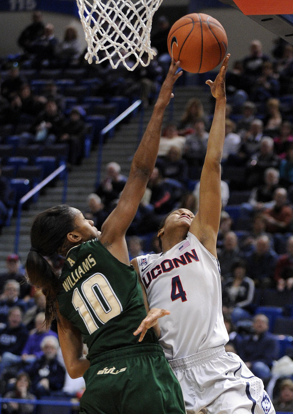 Connecticut's Moriah Jefferson (4) drives past South Florida's Courtney Williams (10) during the first half of an NCAA college basketball game in Hartford, Conn., Sunday, Jan. 26, 2014. (AP Photo/Fred Beckham)