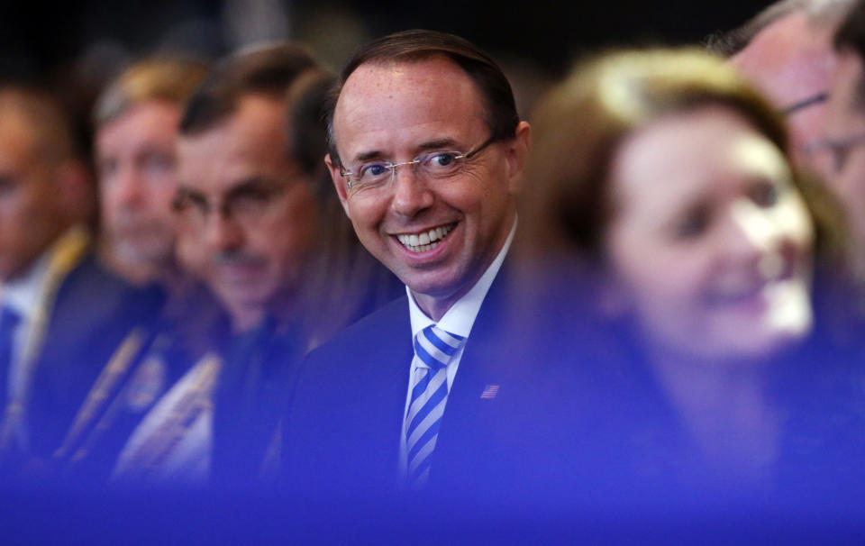 Deputy Attorney General Rod Rosenstein, center, is seat in the audience before President Donald Trump speaks at the International Association of Chiefs of Police annual conference, Monday, Oct. 8, 2018, in Orlando, Fla. (AP Photo/Alex Brandon)