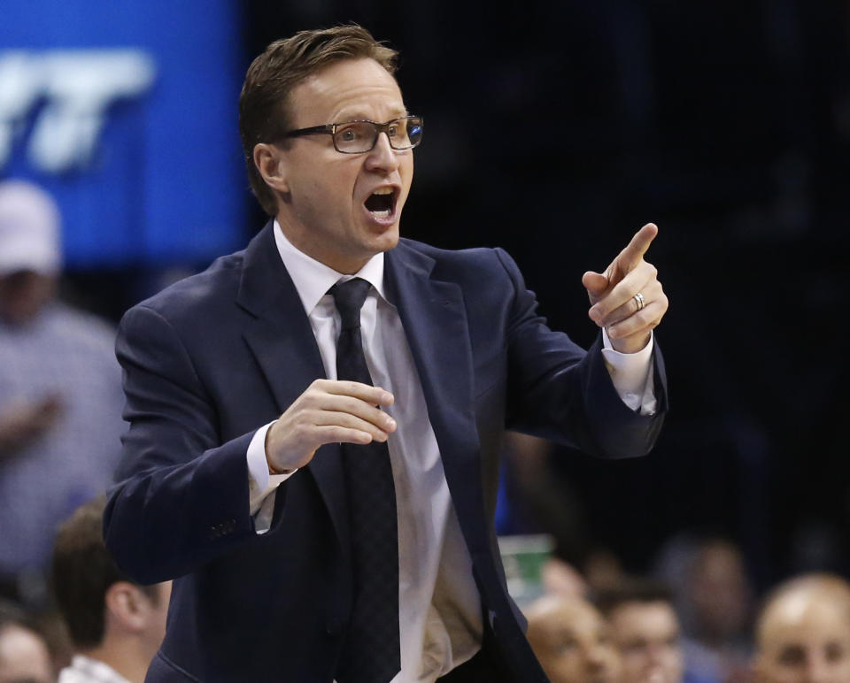 Oklahoma City Thunder head coach Scott Brooks shouts to his team in the second quarter of an NBA basketball game against the Sacramento Kings in Oklahoma City, Sunday, Jan. 19, 2014. (AP Photo/Sue Ogrocki)