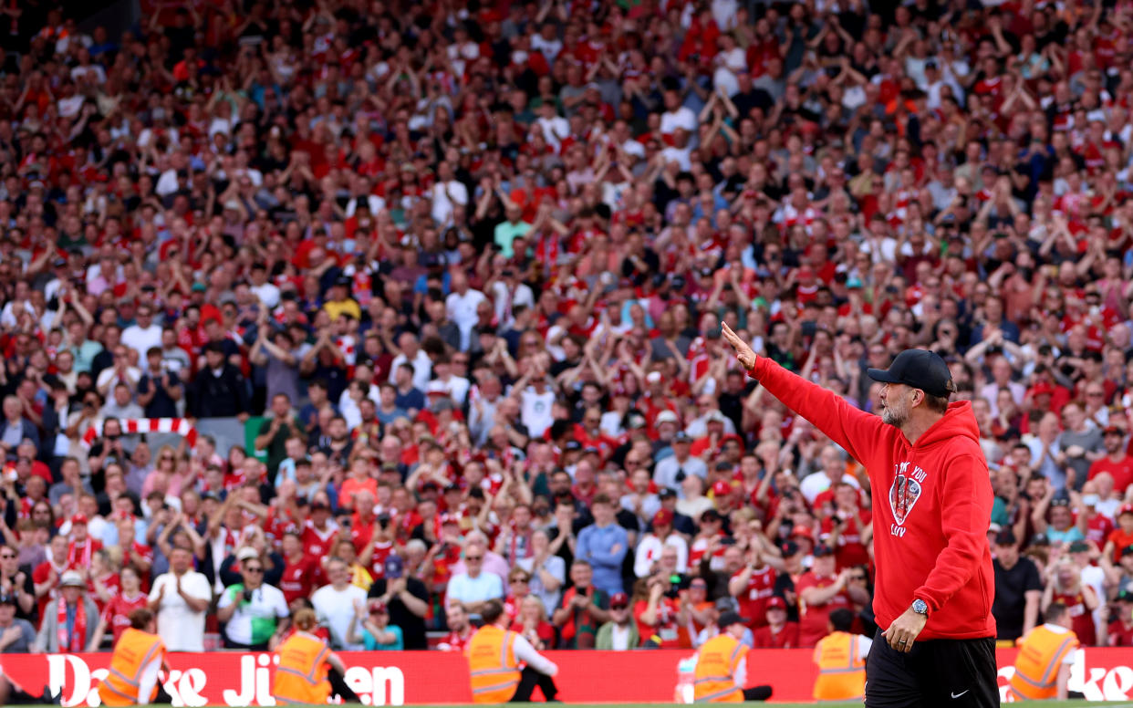 LIVERPOOL, ENGLAND - MAY 19: Jurgen Klopp, Manager of Liverpool, waves goodbye to the fans whilst in front of the Kop, following his final match as Liverpool manager after the Premier League match between Liverpool FC and Wolverhampton Wanderers at Anfield on May 19, 2024 in Liverpool, England. (Photo by Clive Brunskill/Getty Images)