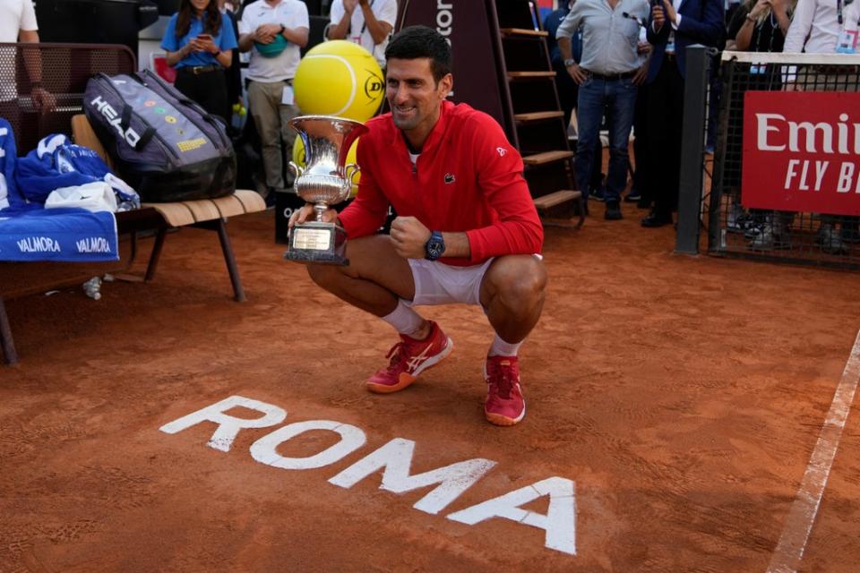 Novak Djokovic celebrates after winning a sixth Italian Open title (Alessandra Tarantino/AP/PA) (AP)