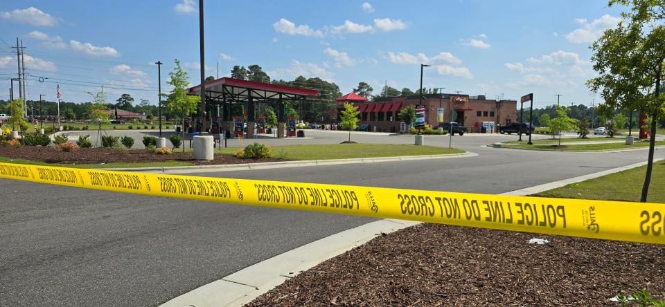 Yellow police tape blocked off both entrances to Sheetz at at 6410 Raeford Road just before 4 p.m. on Sunday, May 26, 2024.