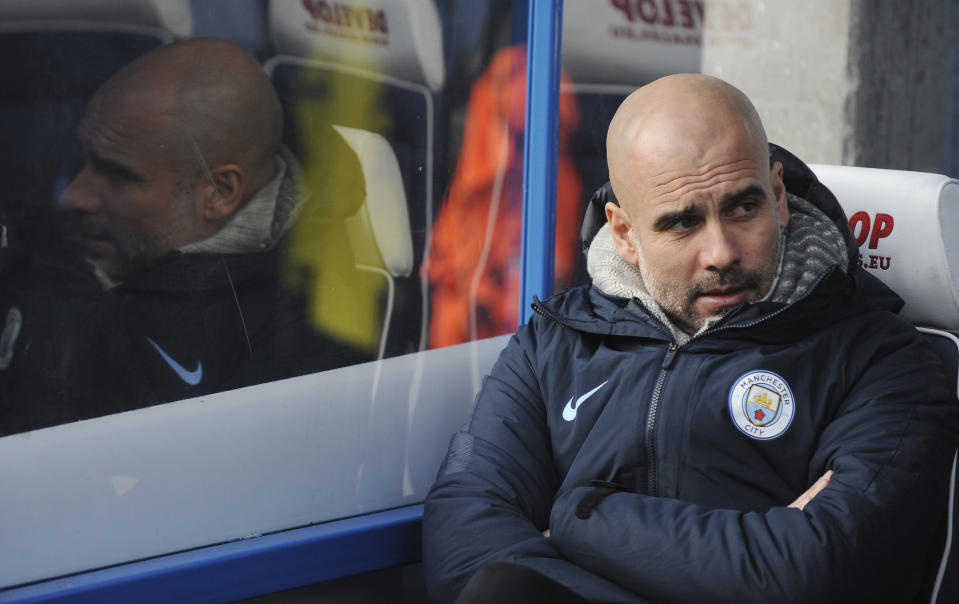 Manchester City manager Josep Guardiola sits on the bench prior to the start of the English Premier League soccer match between Huddersfield Town and Manchester City at John Smith's stadium in Huddersfield, England, Sunday, Jan. 20, 2019. (AP Photo/Rui Vieira)