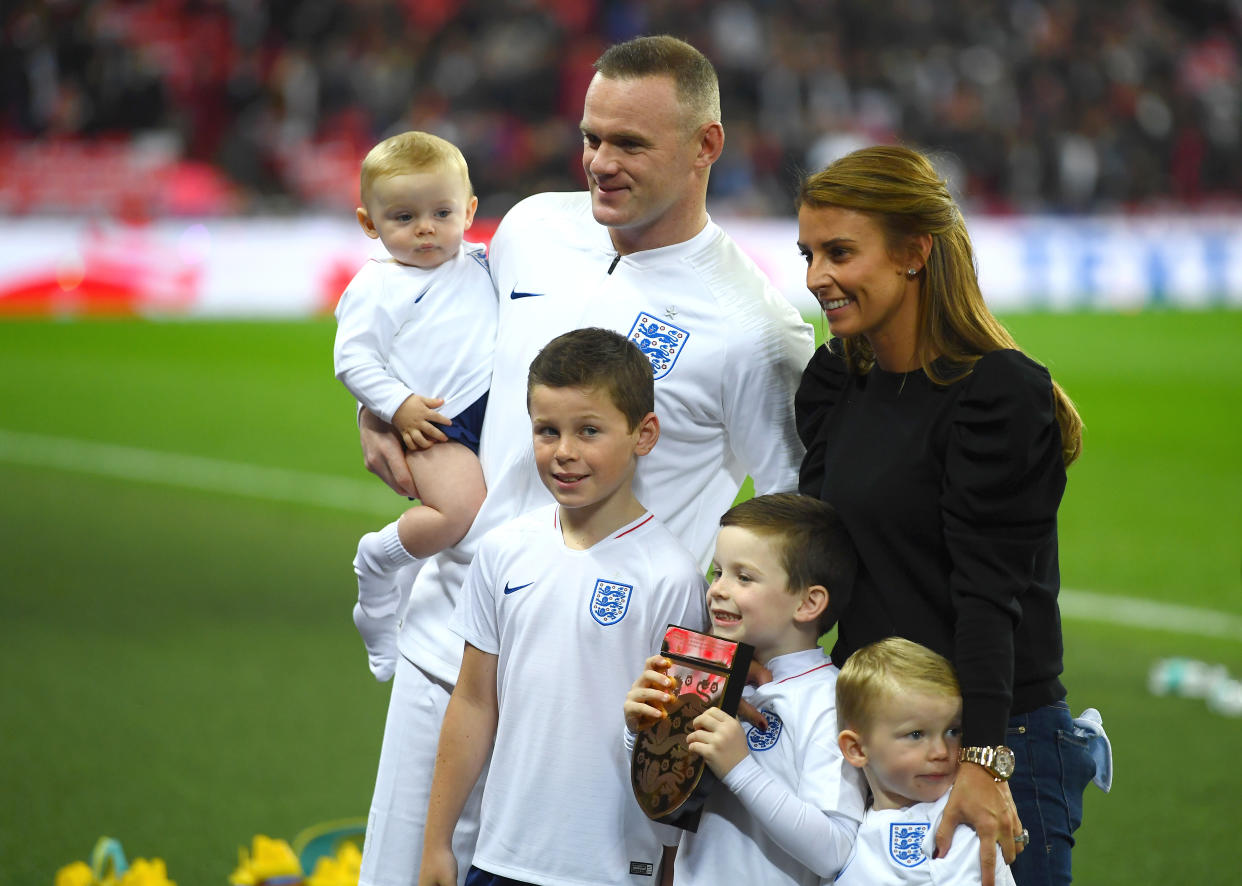 LONDON, ENGLAND - NOVEMBER 15:  Wayne Rooney of England, his wife Coleen Rooney and their children Kit Joseph Ronney, Klay Anthony Rooney, Kai Wayne Rooney and Cass Mac Rooney pose for a photo pitside prior to the International Friendly match between England and United States at Wembley Stadium on November 15, 2018 in London, United Kingdom.  (Photo by Mike Hewitt/Getty Images)