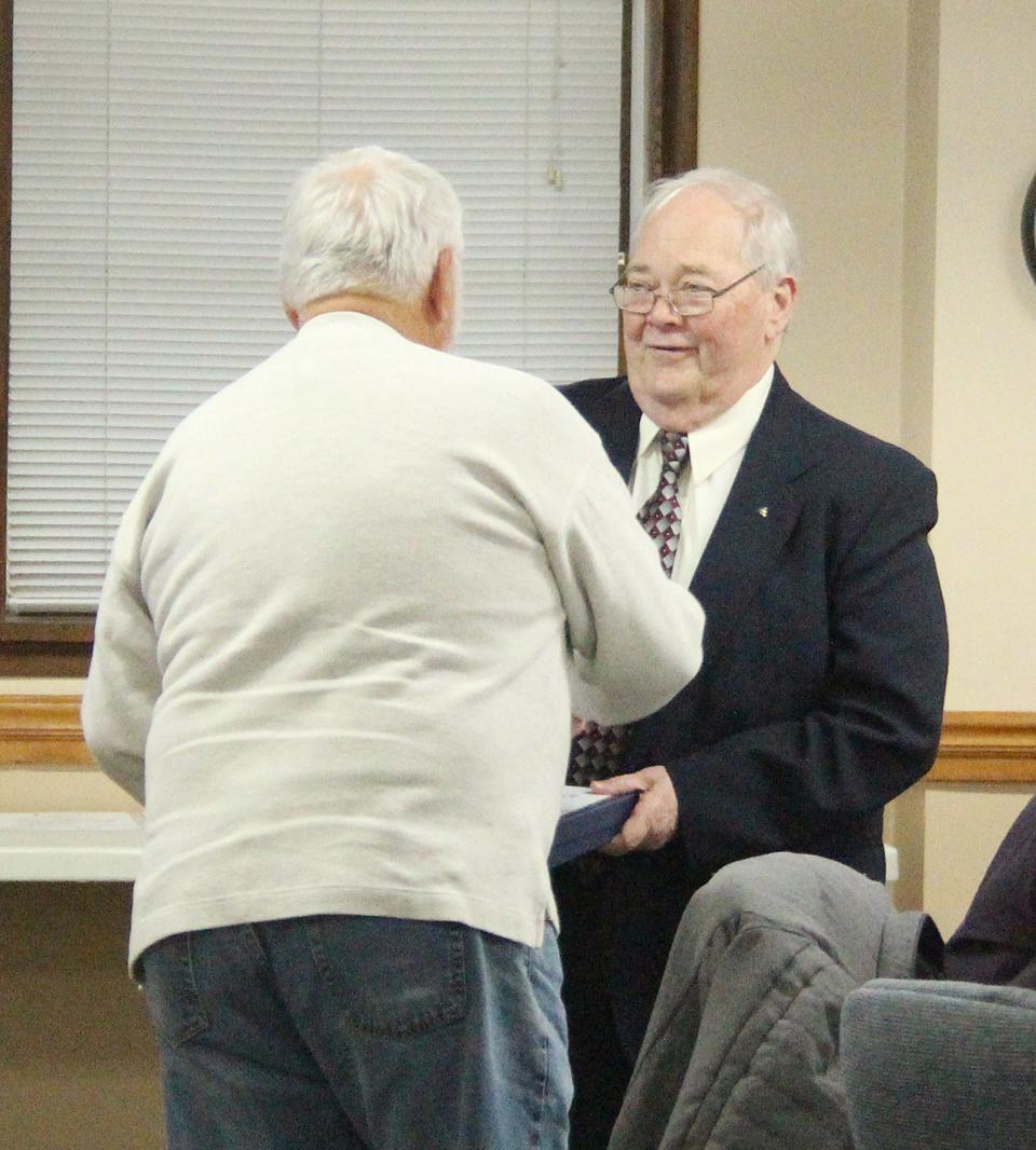 Mayor Bill Alvey, left, presents Alderman Don Hicks with a plaque and offers his thanks for Hicks' 10 years of service as a member of the Pontiac City Council at Monday's meeting. Hicks lost a re-election bid in February to Jerry Causer, a former alderman.