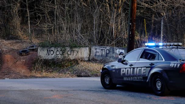 PHOTO: Police drive past the planned site of a public safety training facility that opponents have nicknamed 'Cop City' near Atlanta, Georgia, on Feb. 6, 2023. (Cheney Orr/AFP via Getty Images)