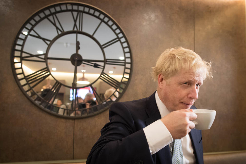 Conservative party leadership candidate Boris Johnson has a drink in the Munch and Wiggles cafe in Oxshott, Surrey.