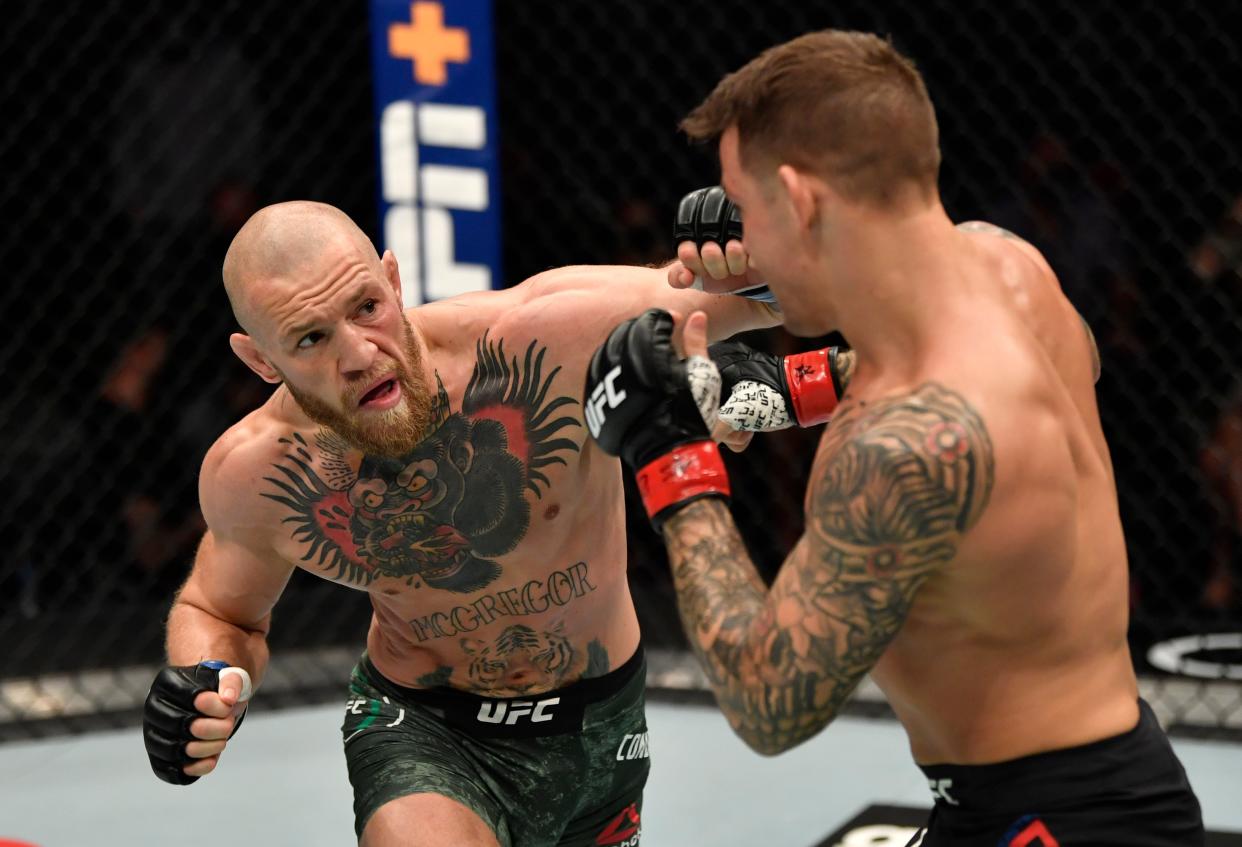 <p>Conor McGregor and Dustin Poirier during their UFC 257 clash</p> (Zuffa LLC via Getty Images)