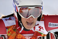 France's Marie Marchand-Arvier sticks out her tongue after a women's downhill training run for the Sochi 2014 Winter Olympics, Saturday, Feb. 8, 2014, in Krasnaya Polyana, Russia. (AP Photo/Gero Breloer)