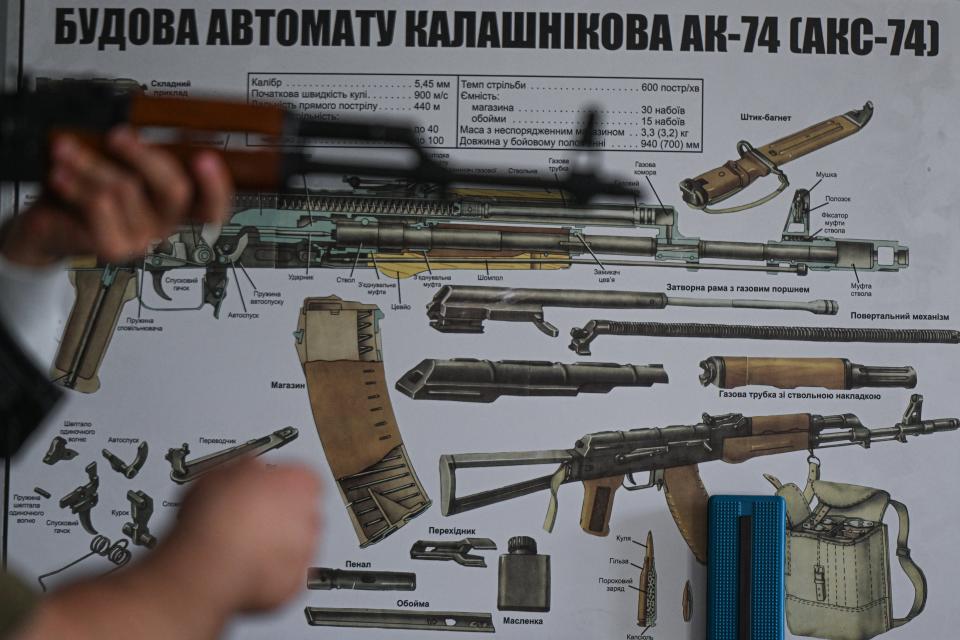 A Kalashnikov rifle and the instruction leaflet for the Kalashnikov rifle (Anadolu Agency via Getty Images)