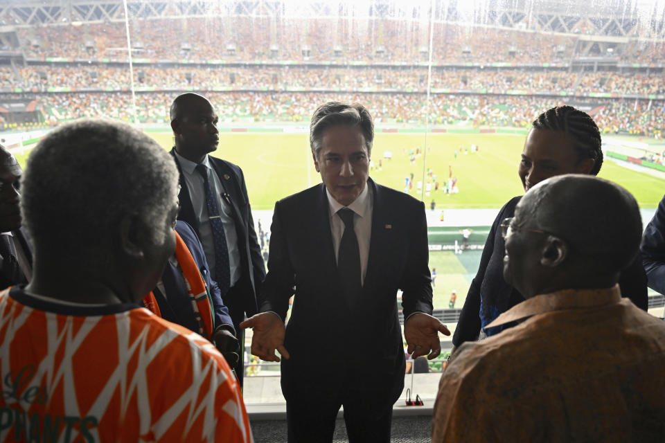 US Secretary of State Antony Blinken, center, speaks to US Ambassador to Ivory Coast Jessica Davis Ba, second right, Vice President of Ivory Coast Tiemoko Meyliet Kone, right, and Prime Minister of Ivory Coast Robert Beugre Mambe, left, following the Africa Cup of Nations (CAN) 2024 group A soccer match between Equatorial Guinea and Ivory Coast at the Alassane Ouattara Stadium in Ebimpe, Abidjan Abidjan, Ivory Coast, Monday, Jan. 22, 2024. (Andrew Caballero-Reynolds/Pool Photo via AP)