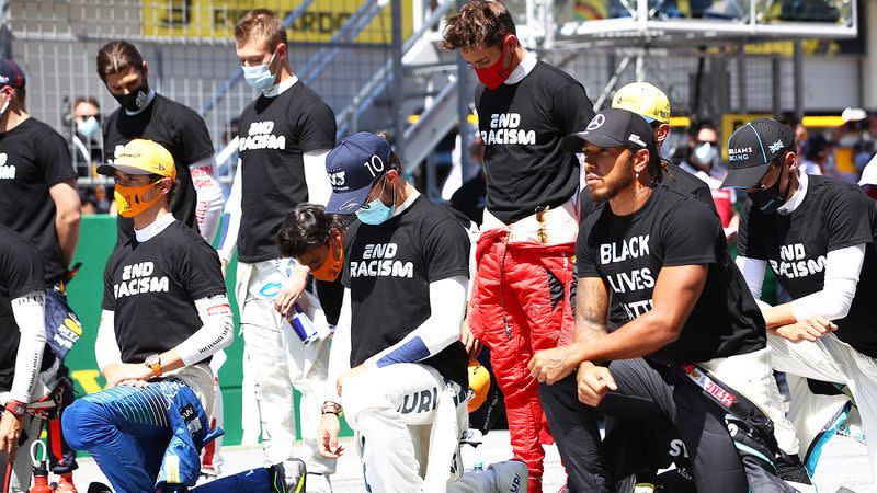 Seen here, drivers join Lewis Hamilton in taking a knee before the Austrian Grand Prix.