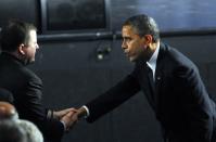 NEWTOWN, CT - DECEMBER 16: U.S. President Barack Obama is greeted by R-Fairfield, John McKinney, the Ct. Senate minority leader, before being seated in the audience for the 90 minute service on December 16, 2012 at Newtown High School in Newtown, Connecticut. Twenty-six people were shot dead, including twenty children, after a gunman identified as Adam Lanza opened fire at Sandy Hook Elementary School. Lanza also reportedly had committed suicide at the scene. A 28th person, believed to be Nancy Lanza, found dead in a house in town, was also believed to have been shot by Adam Lanza. (Photo by Stephen Dunn-Pool/Getty Images)