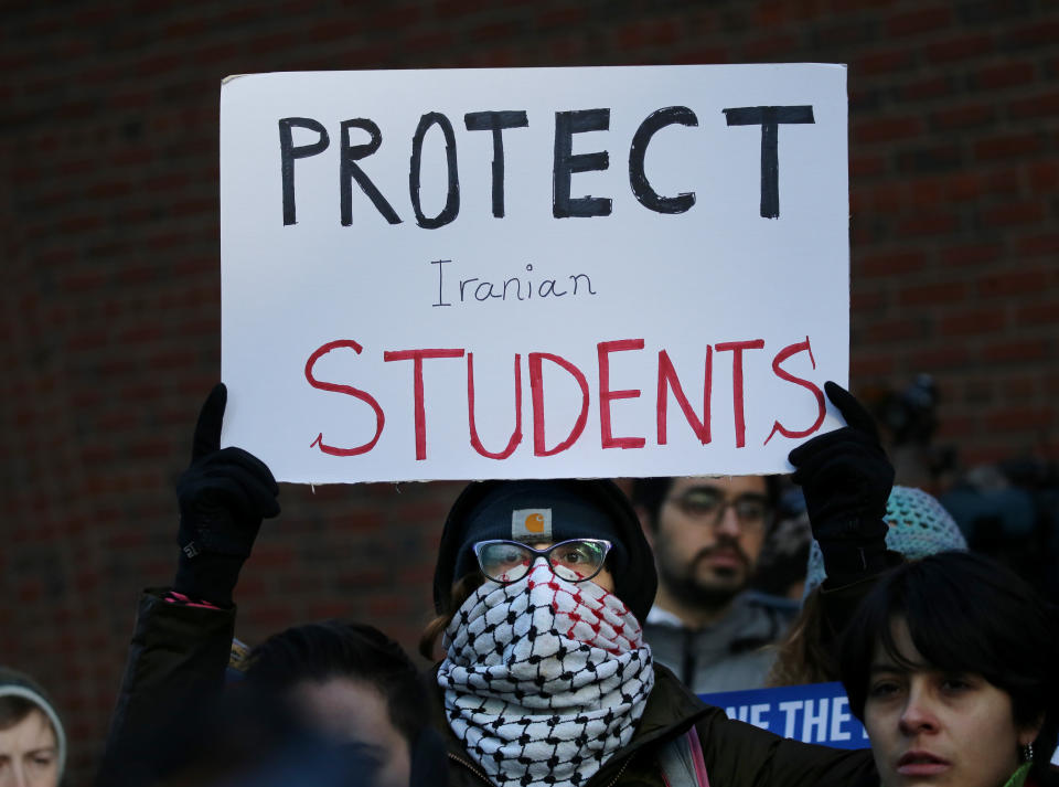 Cassidy Taylor offers support to a deported Iranian student while protesting outside the federal courthouse in Boston on Jan. 21, 2019. The Iranian student was removed from the U.S. in defiance of a court order. (Photo: Craig F. Walker/The Boston Globe via Getty Images)