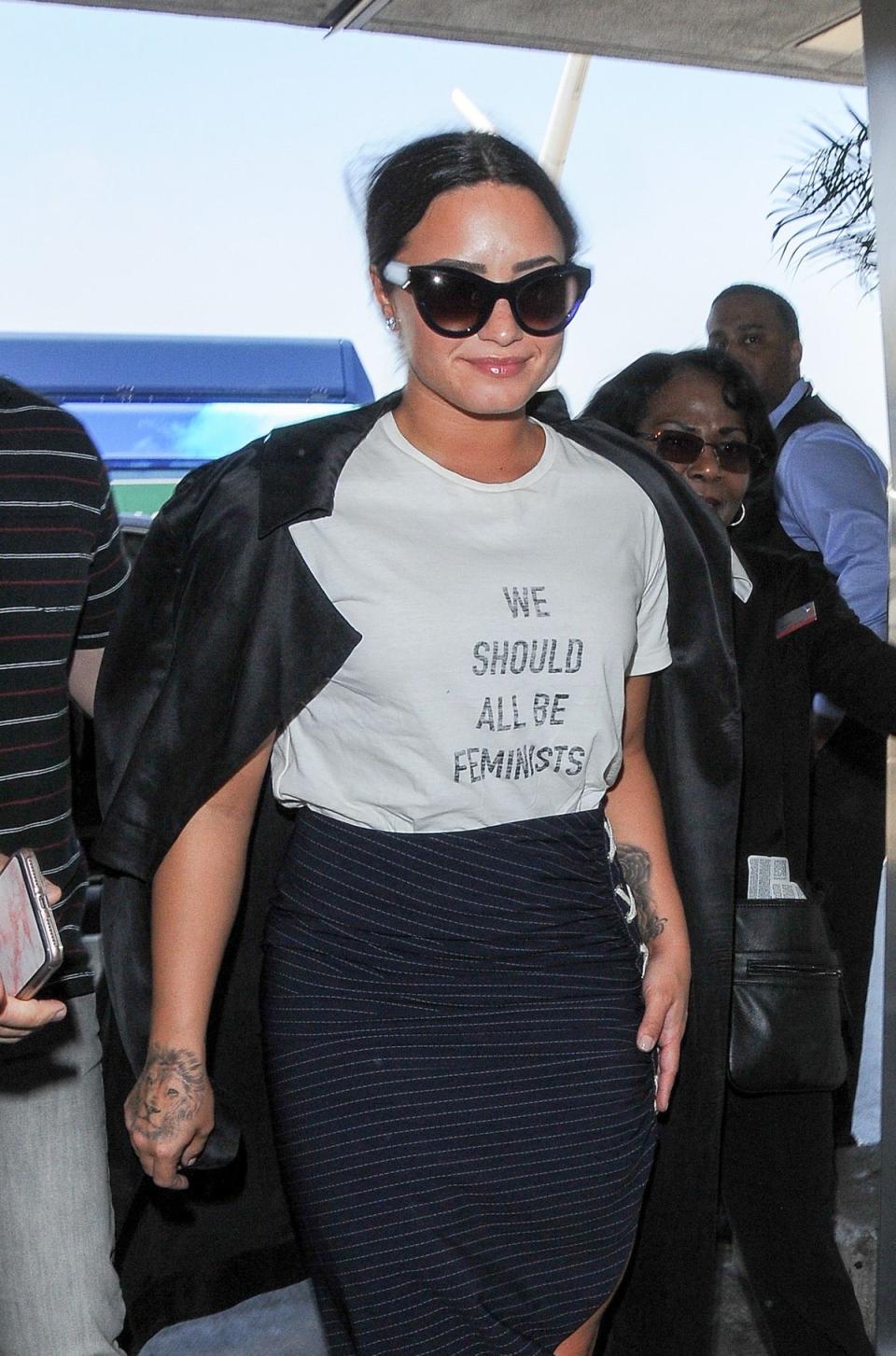 Demi Lovato sports a ‘We Should All Be Feminists’ T-shirt in 2017 (Shutterstock)