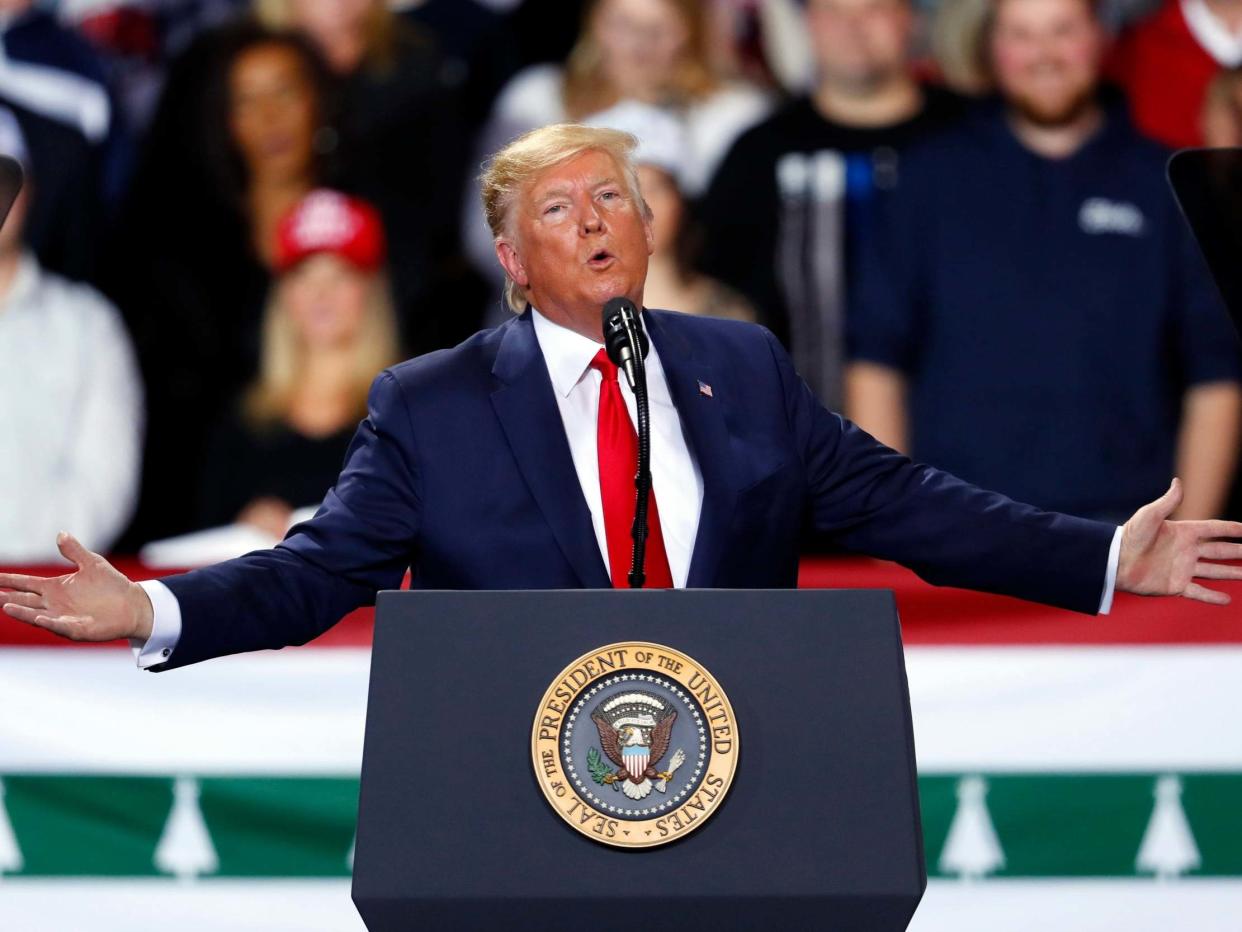 President Donald Trump speaks at a 2020 campaign rally in Battle Creek, Michigan, as the House votes to impeach him in Washington: Paul Sancya/AP