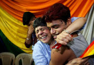 <p>People belonging to the lesbian, gay, bisexual and transgender (LGBT) community celebrate after the Supreme Court’s verdict of decriminalizing gay sex and revocation of the Section 377 law, at an NGO in Mumbai, India, September 6, 2018. REUTERS/Francis Mascarenhas </p>