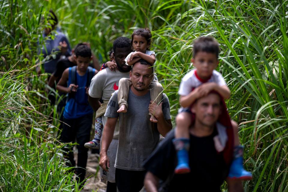 Migrants walk by the jungle near Bajo Chiquito village, the first border control of the Darien Province in Panama, on September 22, 2023.