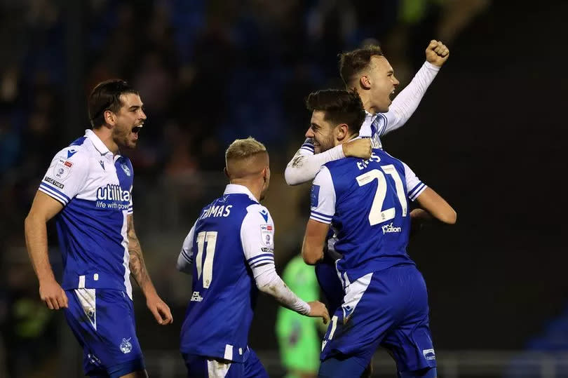 Bristol Rovers players celebrate Antony Evans' free-kick goal against Portsmouth -Credit:James Whitehead/PPAUK