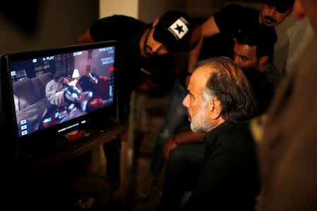 Director Hassan Husni watches Iraqi actors during filming of Òthe hotelÓ TV series, which is being filmed and broadcast during the Muslim holy month of Ramadan, in Baghdad, Iraq May 10, 2019. Picture taken May 10, 2019. REUTERS/Thaier al-Sudani