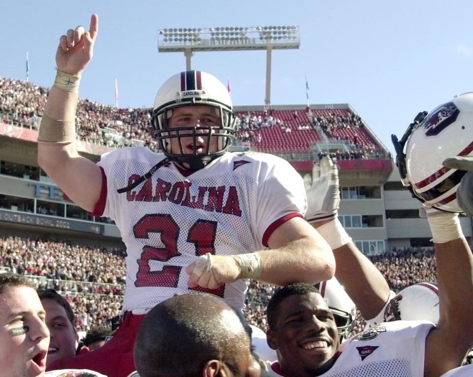 Outback Bowl MVP, South Carolina tailback Ryan Brewer (21) is carried off the field by teammates after they beat Ohio State 24-7 Monday, Jan. 1, 2001, at Raymond James Stadium in Tampa, Fla. (AP Photo/Chris O'Meara)