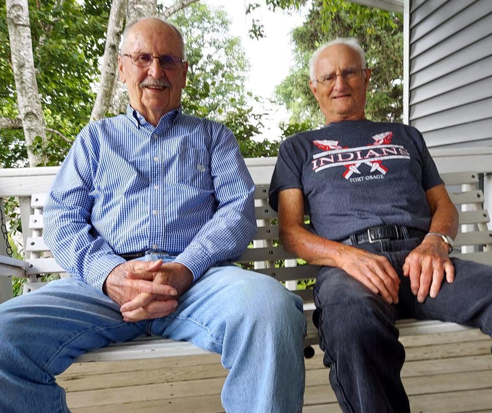 im Asplund (left) and Dean Truelove are pictured earlier this year at Asplund’s home just outside of Oneida. Truelove was in the first graduating class at ROVA in 1949, while Asplund graduated the next year. Truelove’s shirt supports the Missouri high school where his grandson, ROWVA standout Eric Holmes, now coaches.