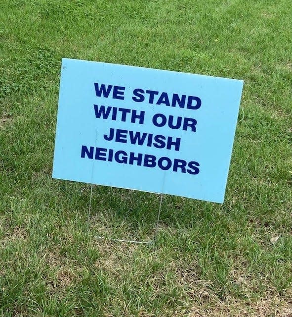 A lawn sign against antisemitism.