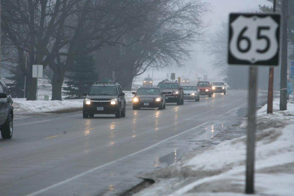 A steady stream of vehicles leaves Northwood, Iowa on Thursday morning, Feb. 20, 2014 following an evacuation due to a chemical fire in a storage-like building that contained fertilizer at Northwood Municipal Airport. Authorities have lifted an evacuation order for residents of the small northern Iowa city . (AP Photo/The Globe-Gazette, Jeff Heinz)