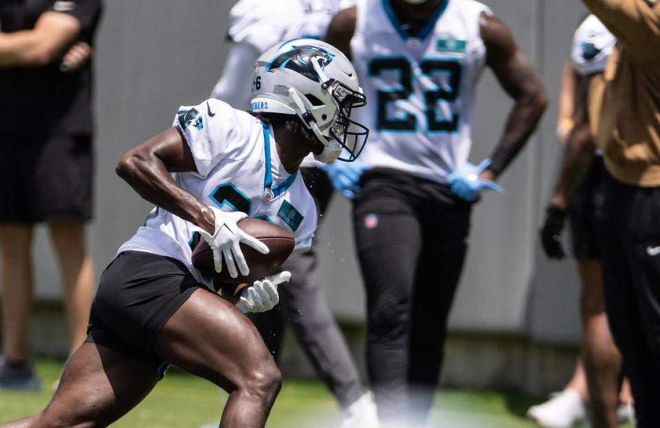 Carolina Panthers Chau Smith-Wade runs a ball at practice in Charlotte, N.C., on Monday, May 20, 2024.