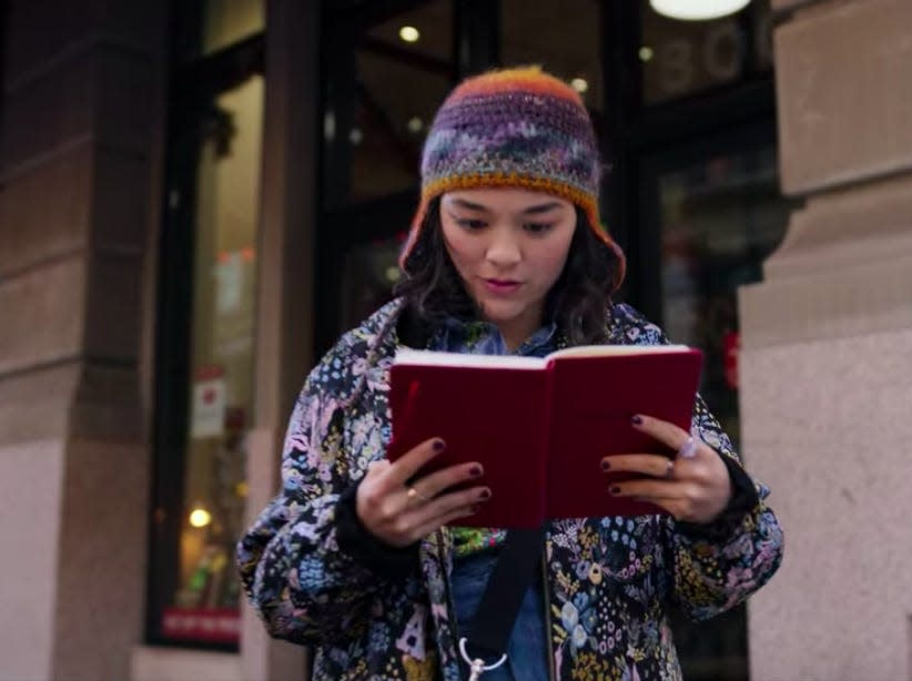 Dash and Lily - lily reading the red notebook