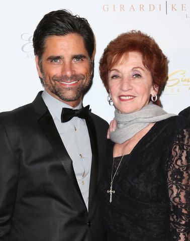<p> David Livingston/Getty</p> (L-R) John Stamos and mother Loretta Stamos are pictured attending the 21st Annual ELLA Awards at The Beverly Hilton Hotel on February 20, 2014 in Beverly Hills, California.