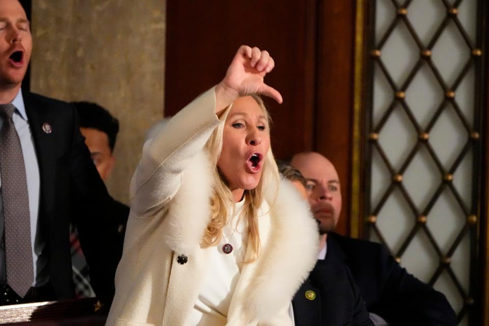 Rep. Marjorie Taylor Greene, R-GA, yells in the chambers as President Joe Biden speaks during the State of the Union address from the House chamber of the United States Capitol in Washington.