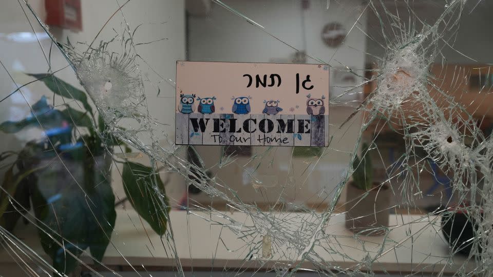 A bullet-shuttered window of the entrance to a kindergarten is seen in Kibbutz Be'eri on Wednesday, Oct. 11, 2023 - Baz Ratner/AP