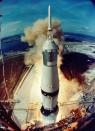 The Saturn V rocket carrying the the Apollo 11 crew lifts off from Kennedy Space Center in Florida