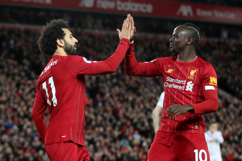 Mohamed Salah (11) and Sadio Mane look to lead Liverpool past bitter rival Manchester United on Sunday. (Action Images via Reuters/Carl Recine)