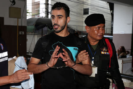 FILE PHOTO: Hakeem AlAraibi, a former member of Bahrain's national soccer team who holds a refugee status in Australia arrives at court after he was arrested last month on arrival at a Bangkok airport based on an Interpol notice issued at Bahrain's request, in Bangkok, Thailand December 11, 2018. REUTERS/Athit Perawongmetha/File Photo