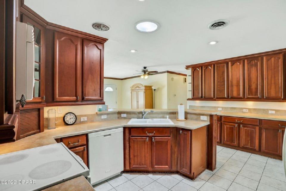 This beautifully updated kitchen features newer cabinets, lots of storage and a separate dining area.