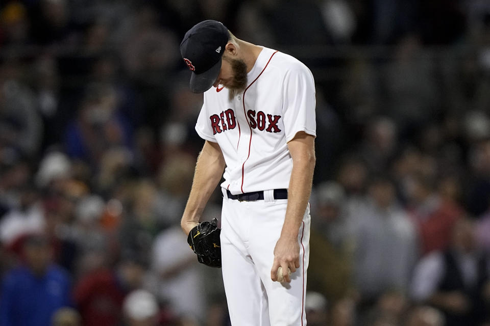 Boston Red Sox starting pitcher Chris Sale reacts after giving up a two run double to Houston Astros' Yordan Alvarez during the sixth inning in Game 5 of baseball's American League Championship Series Wednesday, Oct. 20, 2021, in Boston. (AP Photo/David J. Phillip)