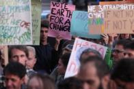 Activists participate in a rally demanding action on climate change in Sofia