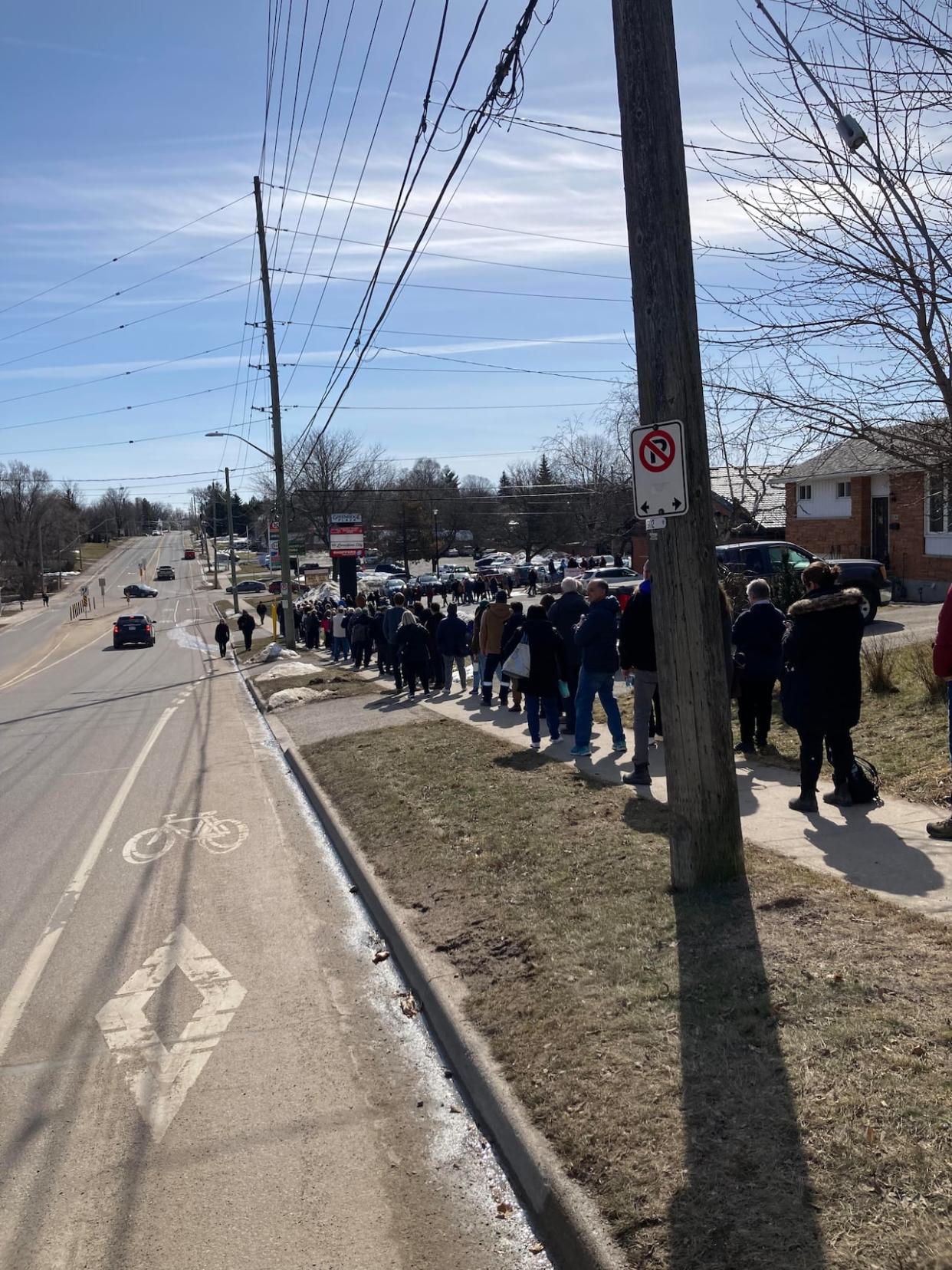 Hundreds waited in line for a chance at a family doctor during CDK Family Medicine and Walk-In Clinic's first rostering day in late February. (Jamie Corbett - image credit)