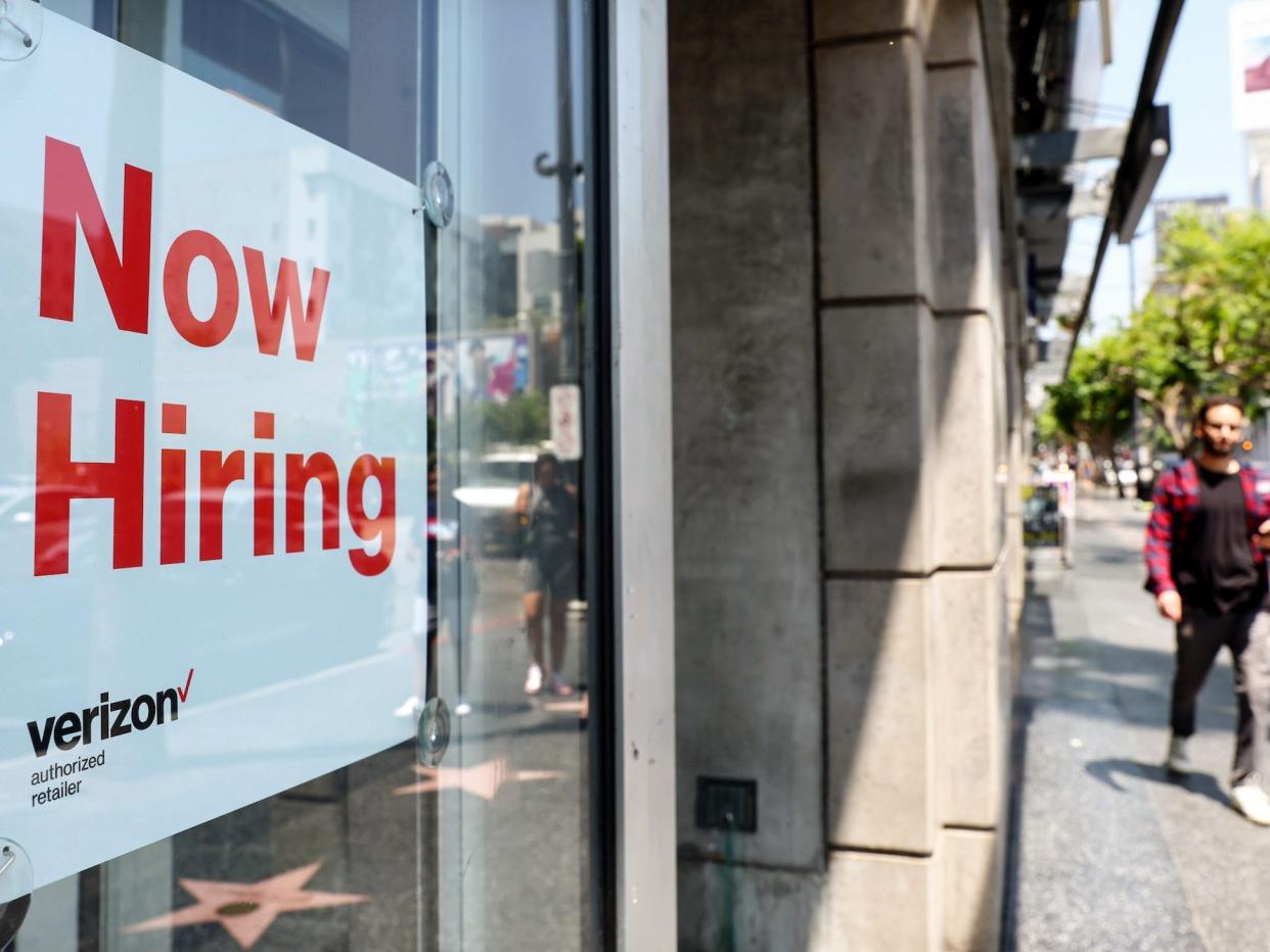 A hiring sign at a store