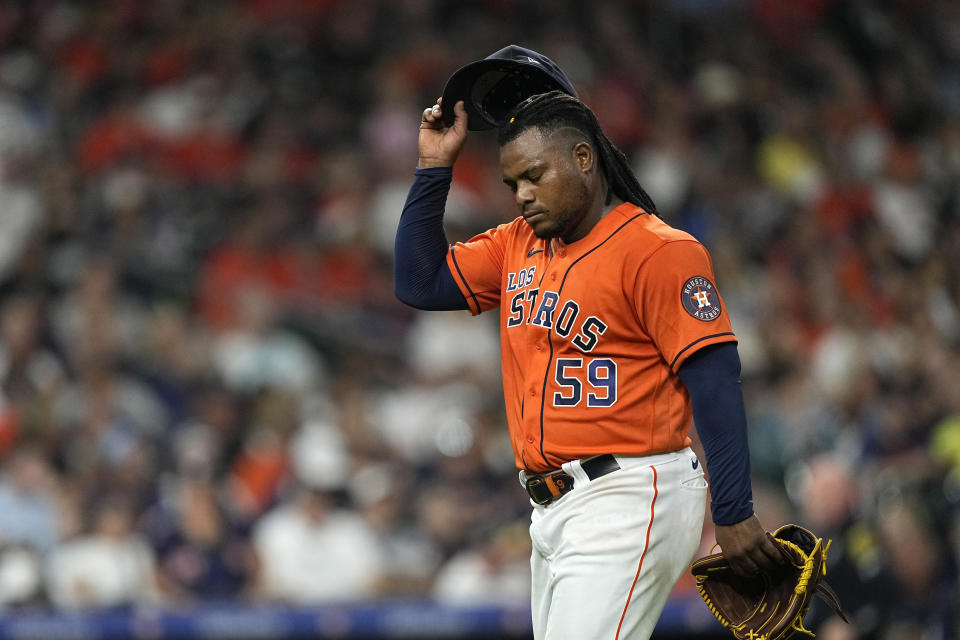 Houston Astros starting pitcher Framber Valdez walks toward the dugout after being pulled during the sixth inning of a baseball game against the Kansas City Royals Friday, Sept. 22, 2023, in Houston. (AP Photo/David J. Phillip)