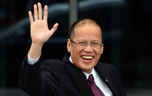 Philippines President Benigno Aquino waves after arriving for an Asia-Pacific Economic Cooperation (APEC) summit in the Russian city of Vladivostok on September 8. Beijing and Taipei have dismissed Manila's renaming part of the South China Sea as the "West Philippine Sea", with both saying the designation did not affect their own sovereignty claims