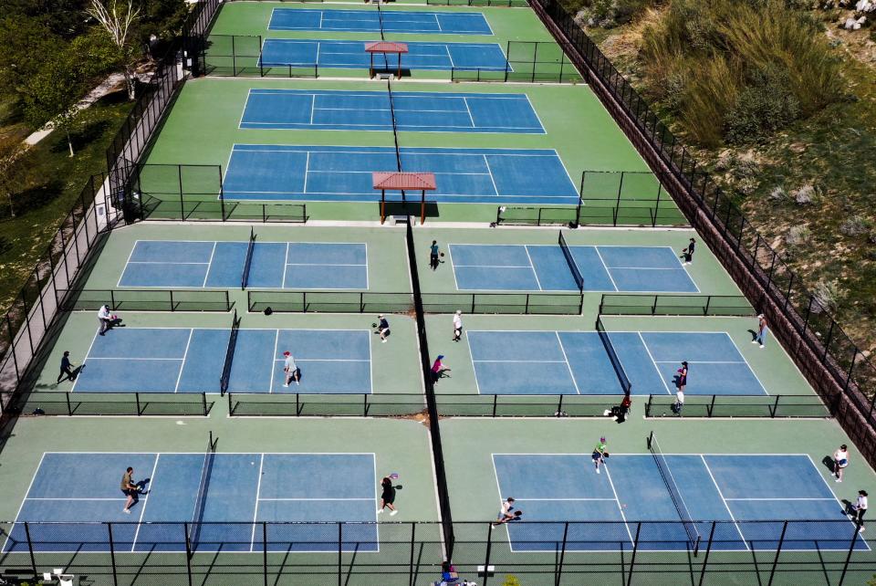 People play pickleball while the tennis courts sit vacant at 11th Avenue Park in Salt Lake City on Friday, May 12, 2023. | Laura Seitz, Deseret News