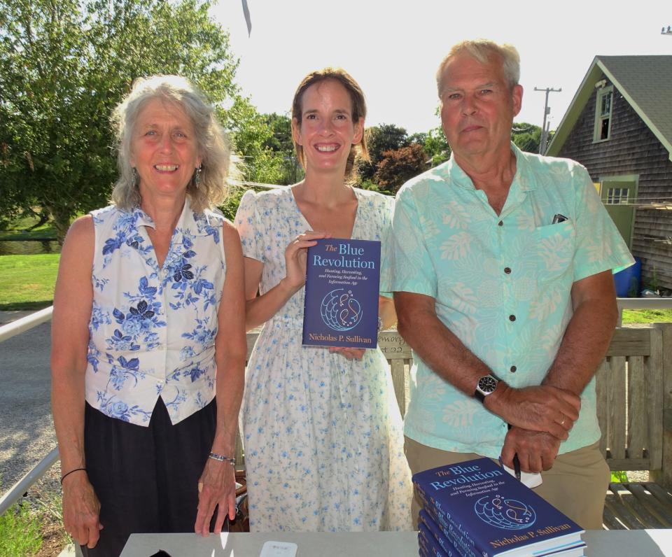 Westport River Watershed Alliance's Deborah Weaver, Elizabeth Lane from Partners Village Store Books, and Nicholas Sullivan, author, at a book signing event last summer.