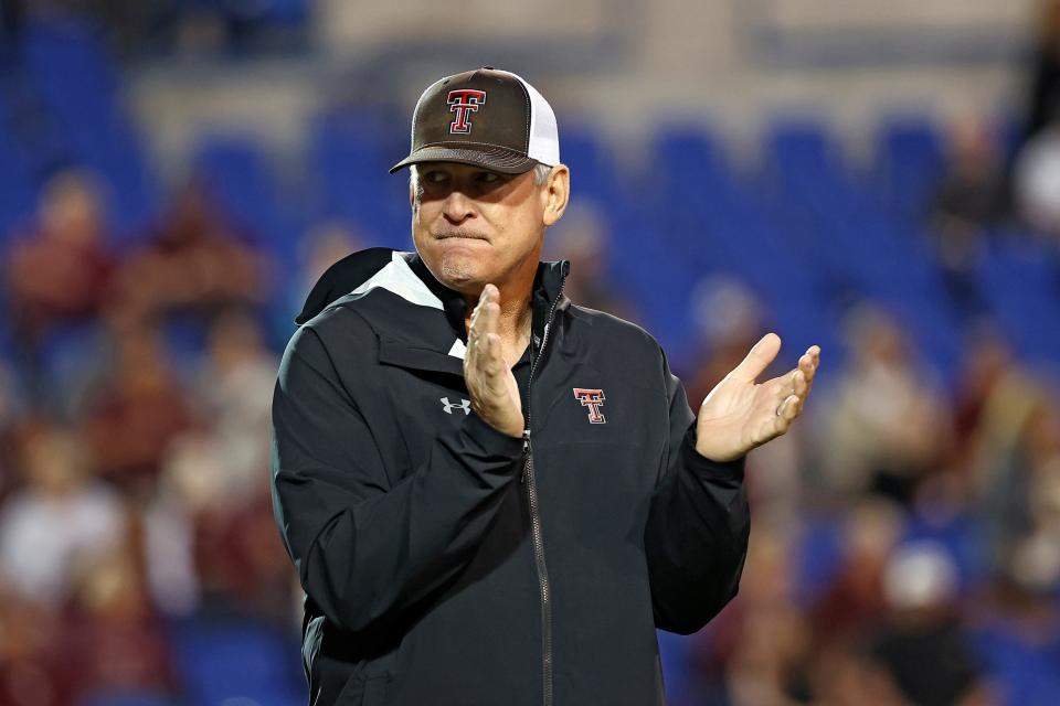 Texas Tech defensive coordinator Keith Patterson claps while watching the team warm up before the Liberty Bowl NCAA college football game on Tuesday, Dec. 28, 2021, in Memphis, Tenn.