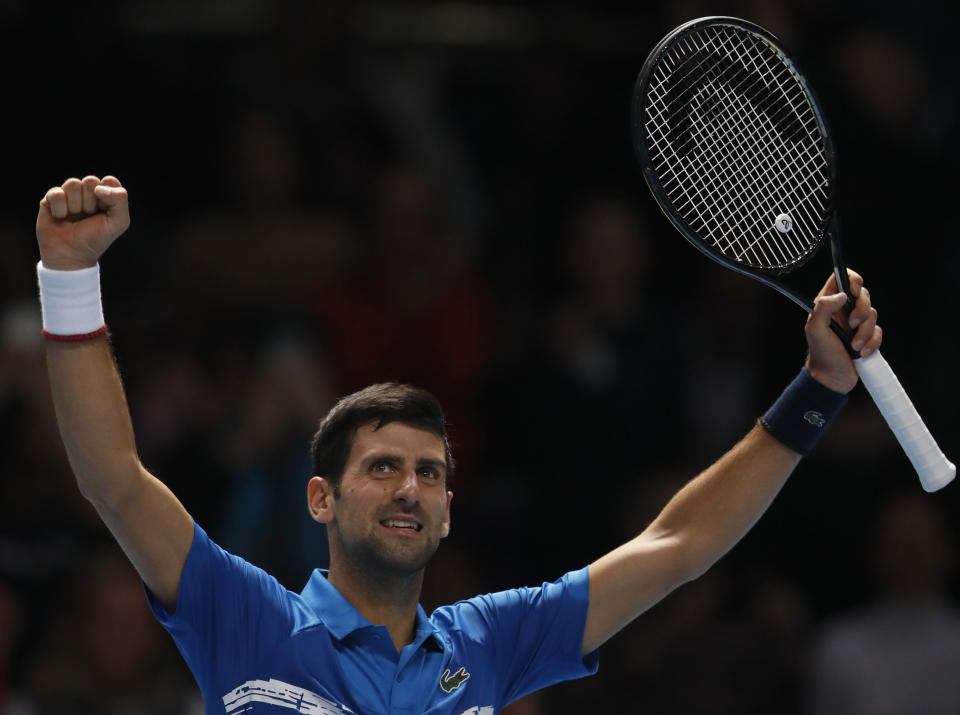 Serbia's Novak Djokovic celebrates after defeating Italy's Matteo Berrettini in their ATP World Tour Finals singles tennis match at the O2 Arena in London, Sunday, Nov. 10, 2019. (AP Photo/Alastair Grant)