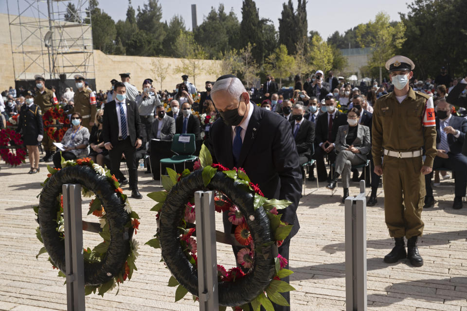 Israeli Prime Minister Benjamin Netanyahu lays a wreath at a ceremony marking the annual Holocaust Remembrance Day, at Yad Vashem Holocaust Memorial in Jerusalem, Thursday, April 8, 2021. (AP Photo/Maya Alleruzzo, Pool)