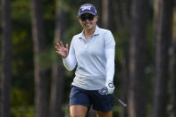 Mina Harigae waves after her putt on the 17th green during the first round of the U.S. Women's Open golf tournament at the Pine Needles Lodge & Golf Club in Southern Pines, N.C. on Thursday, June 2, 2022. (AP Photo/Chris Carlson)