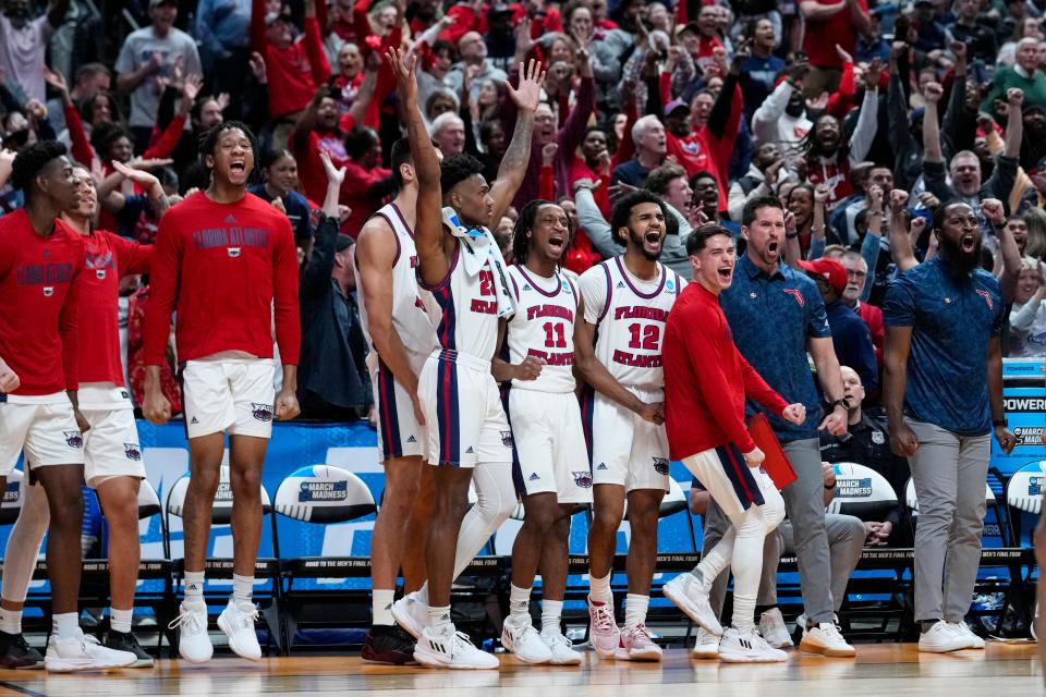 The Florida Atlantic bench celebrates in the second half of a second-round college basketball game against Fairleigh Dickinson in the men's NCAA Tournament in Columbus, Ohio, Sunday, March 19, 2023. Florida Atlantic defeated Fairleigh Dickinson 78-70. (AP Photo/Michael Conroy)